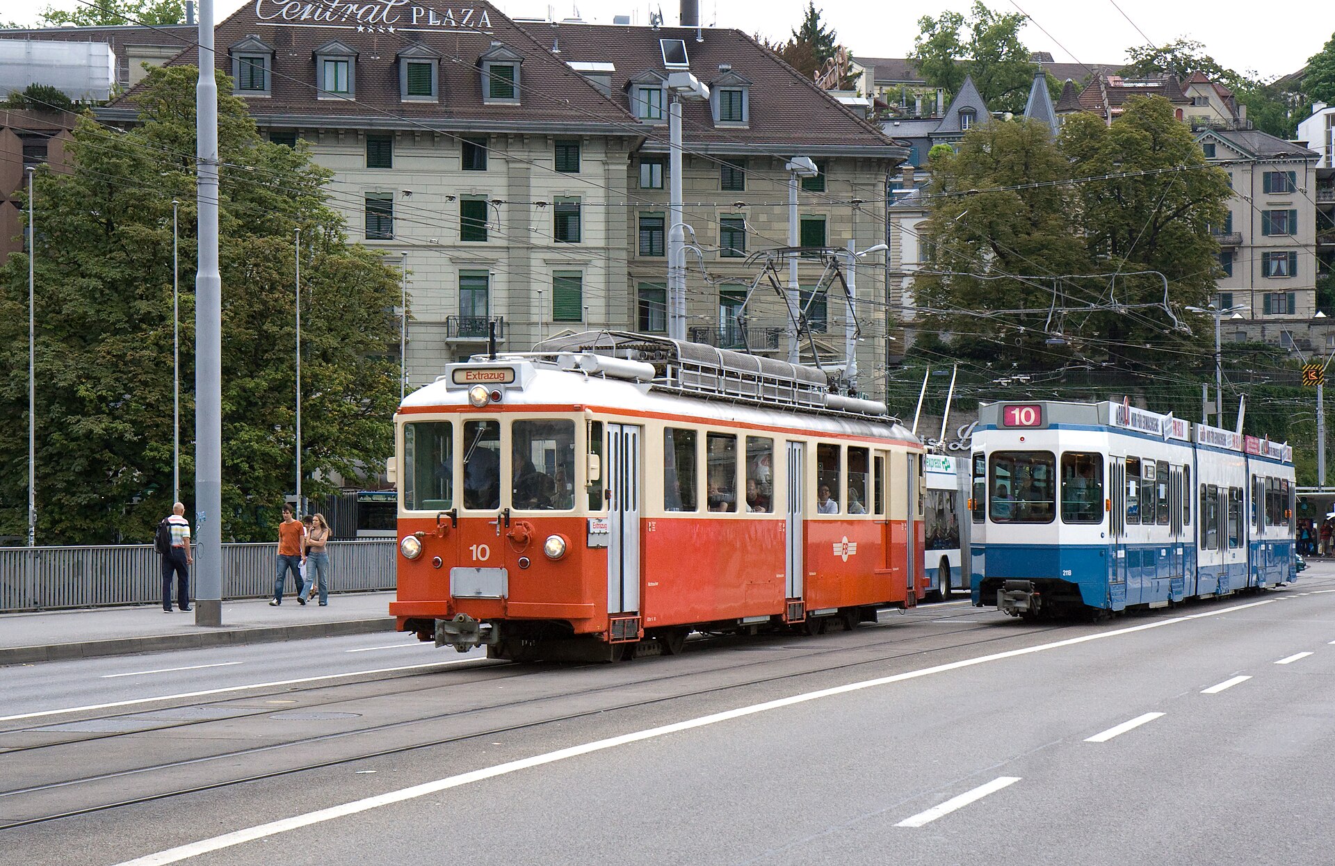 Historic and modern Zurich trams crossing Bahnhofbrücke